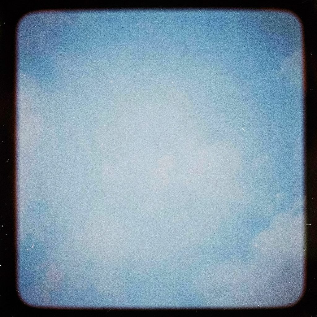 Dark slate-toned photograph of an abstract exploit-themed graphic with faint code-like texture and grain